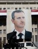 220865-a-picture-of-syrias-president-bashar-al-assad-is-seen-on-a-central-ban.jpg